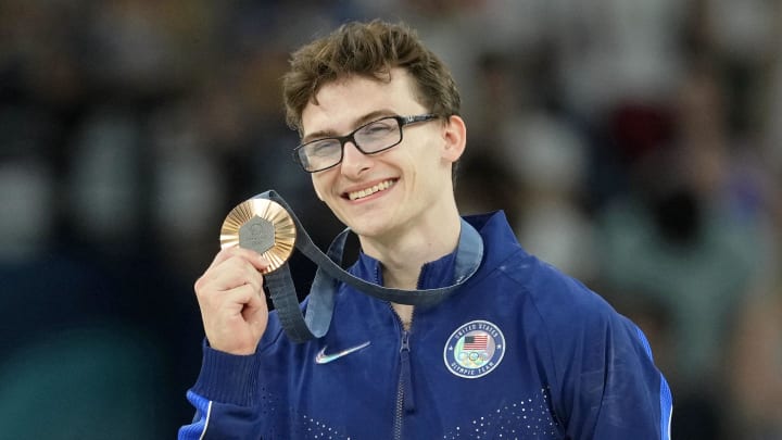 Aug 3, 2024; Paris, France; Stephen Nedoroscik of the United States poses for a photo with his bronze medal on the pommel horse on the first day of gymnastics event finals during the Paris 2024 Olympic Summer Games at Bercy Arena. 