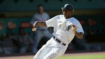 Juan Pierre slides into home plate