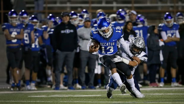 Decatur's Adam Martinez runs against Mountain View in a 4A Division I Texas high school playoff game on Nov. 21, in Odessa.