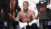 Paul weighs in the day before his fight against Tyson.