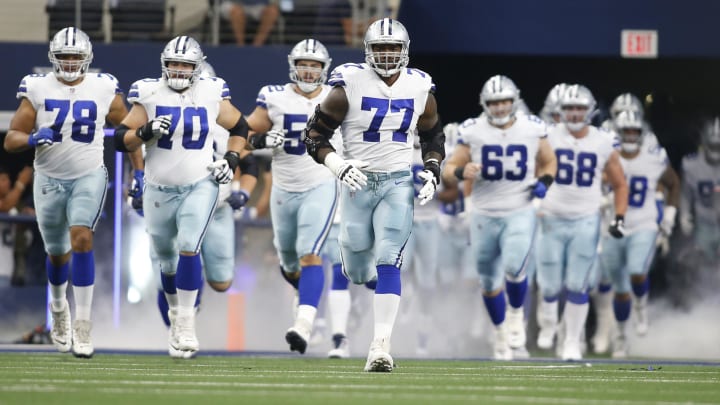 Oct 3, 2021; Arlington, Texas, USA; Dallas Cowboys offensive tackle Tyron Smith (77) runs on the field before the game against the Carolina Panthers at AT&T Stadium. Mandatory Credit: Tim Heitman-USA TODAY Sports