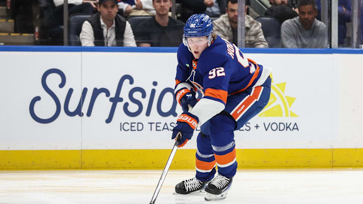 Apr 9, 2026; Elmont, New York, USA;  New York Islanders right wing Simon Holmstrom (92) plays the puck in the second period against the Toronto Maple Leafs at UBS Arena. Mandatory Credit: Wendell Cruz-Imagn Images