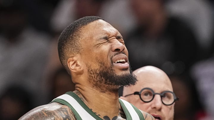 Milwaukee Bucks guard Damian Lillard (0) reacts after being injured against the Atlanta Hawks during the first half at State Farm Arena on March 4, 2025.