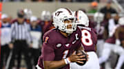 Oct 24, 2025; Blacksburg, Va.; Virginia Tech quarterback Kyron Drones (1) looks to pass against California.
