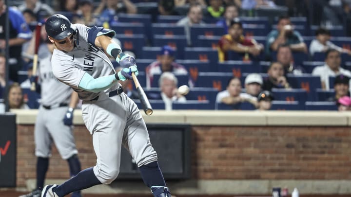 Jun 26, 2024; New York City, New York, USA;  New York Yankees center fielder Aaron Judge (99) hits a two run home run in the sixth inning against the New York Mets at Citi Field. Mandatory Credit: Wendell Cruz-USA TODAY Sports