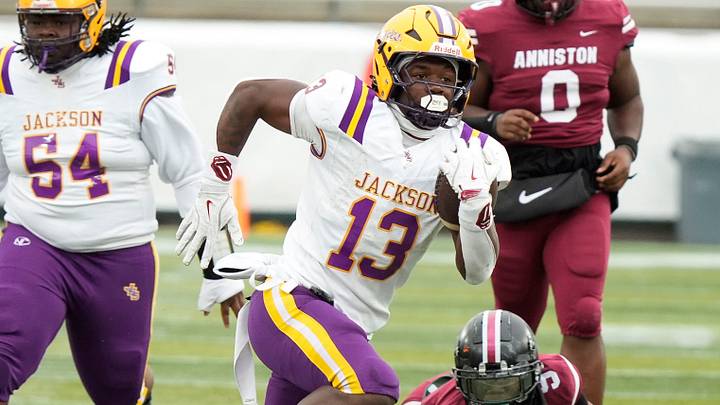 Dec 5, 2025; Birmingham, AL, USA; Jackson's EJ Crowell (13) breaks away for one of his five touchdowns on a long run against Anniston at Protective Life Stadium in the AHSAA 4A State Championship game.