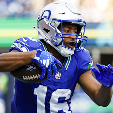 Sep 8, 2024; Seattle, Washington, USA; Seattle Seahawks wide receiver Tyler Lockett (16) runs for yards after the catch against the Denver Broncos during the third quarter at Lumen Field. Mandatory Credit: Joe Nicholson-Imagn Images