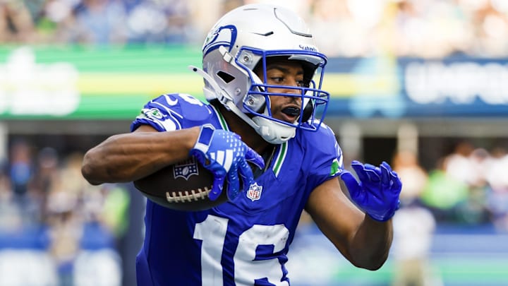 Sep 8, 2024; Seattle, Washington, USA; Seattle Seahawks wide receiver Tyler Lockett (16) runs for yards after the catch against the Denver Broncos during the third quarter at Lumen Field. Mandatory Credit: Joe Nicholson-Imagn Images