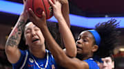 SMU's center Jessica Peterson (35) and SMU's guard Jasmine Smith (10) rebound the ball against Texas Tech in the second round of the Women's National Invitational basketball tournament, Monday, March 20, 2023, at United Supermarkets Arena.