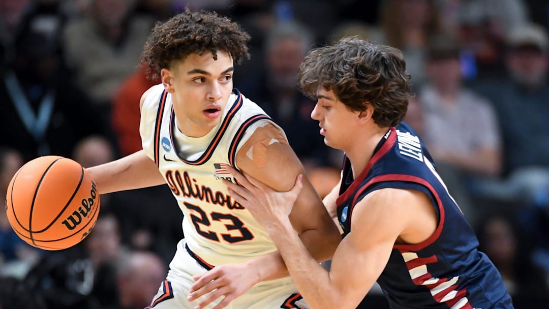 Illinois Fighting Illini guard Keaton Wagler (23) is defended by Penn Quakers guard AJ Levine (0) Thursday, March 19, 2026, during the NCAA Men’s Basketball Tournament first round game at Bon Secours Wellness Arena in Greenville, South Carolina. Illinois Fighting Illini guard Keaton Wagler (23) is defended by Penn Quakers guard AJ Levine (0) Thursday, March 19, 2026, during the NCAA Men’s Basketball Tournament first round game at Bon Secours Wellness Arena in Greenville, South Carolina.