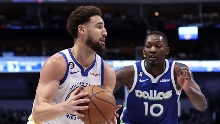 Nov 29, 2022; Dallas, Texas, USA;  Golden State Warriors guard Klay Thompson (11) drives to the basket as Dallas Mavericks forward Dorian Finney-Smith (10) defends during the first quarter at American Airlines Center. Mandatory Credit: Kevin Jairaj-Imagn Images