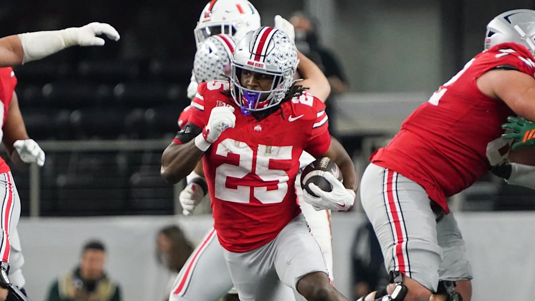 Dec 31, 2025; Arlington, TX, USA; Ohio State Buckeyes running back Bo Jackson (25) runs the ball in the third quarter against the Miami Hurricanes during the 2025 Cotton Bowl and quarterfinal game of the College Football Playoff at AT&T Stadium. Mandatory Credit: Raymond Carlin III-Imagn Images