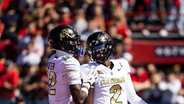 Oct 19, 2024; Tucson, Arizona, USA; Colorado Buffalos quarterback Shedeur Sanders (2) with wide receiver Travis Hunter (12) against the Arizona Wildcats at Arizona Stadium. Mandatory Credit: Mark J. Rebilas-Imagn Images