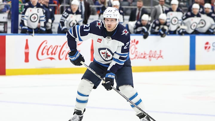 Mar 4, 2025; Elmont, New York, USA;  Winnipeg Jets left wing Nikolaj Ehlers (27) controls the puck in the third period against the New York Islanders at UBS Arena. Mandatory Credit: Wendell Cruz-Imagn Images