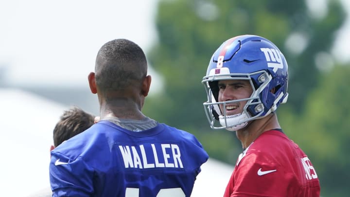 Jul 27, 2023; East Rutherford, NJ, USA;  New York Giants tight end Darren Waller, left, and quarterback Daniel Jones talk on day two of training camp at the Quest Diagnostics Training Facility.  