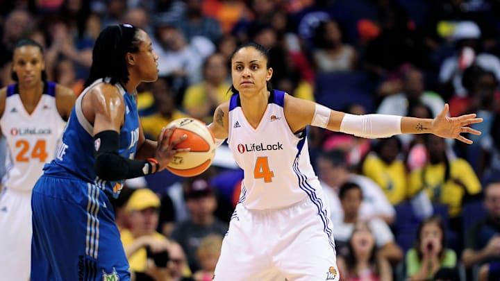 Sep 11, 2011; Phoenix, AZ, USA; Phoenix Mercury forward 	Candice Dupree (4) guards Minnesota Lynx guard Alexis Hornbuckle (14) during the second half at the US Airways Center.  The Lynx defeated the Mercury 96-90. Mandatory Credit: Jennifer Stewart-Imagn Images
