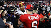Washington Commanders quarterback Jayden Daniels greets Tampa Bay Buccaneers star Baker Mayfield at NFL playoff game