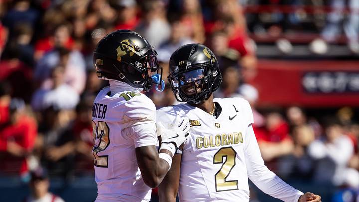 Oct 19, 2024; Tucson, Arizona, USA; Colorado Buffalos quarterback Shedeur Sanders (2) with wide receiver Travis Hunter (12) against the Arizona Wildcats at Arizona Stadium. Mandatory Credit: Mark J. Rebilas-Imagn Images