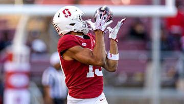 Nov 16, 2024; Stanford, California, USA;  Stanford Cardinal wide receiver Emmett Mosley V (10) catches a pass on the sidelines against the Louisville Cardinals during the fourth quarter at Stanford Stadium. Mandatory Credit: Bob Kupbens-Imagn Images