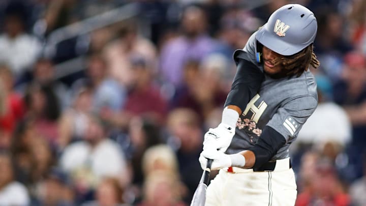 Sep 13, 2024; Washington, District of Columbia, USA; Washington Nationals outfielder James Wood (29) hits a single during the eighth inning of a baseball game against the Miami Marlins at Nationals Park.