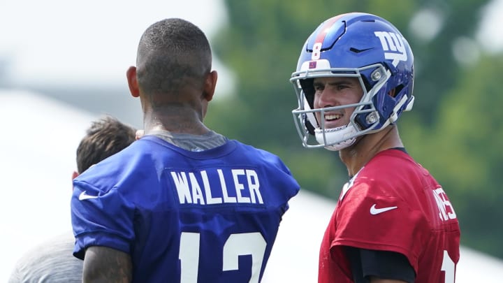 Jul 27, 2023; East Rutherford, NJ, USA;  New York Giants tight end Darren Waller, left, and quarterback Daniel Jones talk on day two of training camp at the Quest Diagnostics Training Facility. 