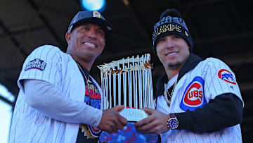 Chicago Cubs staff assistant Franklin Font  (left) and second baseman Javier Baez (right) hoist the 2016 World Series trophy.