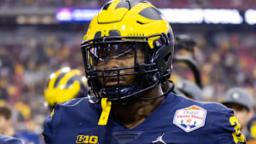 Dec 31, 2022; Glendale, Arizona, USA; Michigan Wolverines defensive lineman Rayshaun Benny (26) against the TCU Horned Frogs during the 2022 Fiesta Bowl at State Farm Stadium. Mandatory Credit: Mark J. Rebilas-Imagn Images