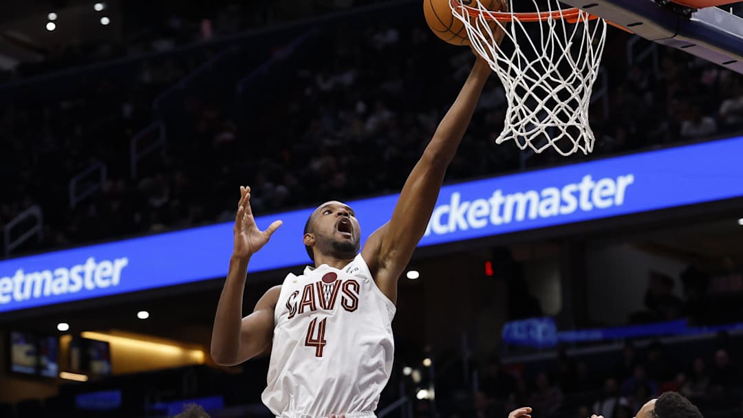 Dec 12, 2025; Washington, District of Columbia, USA; Cleveland Cavaliers center Evan Mobley (4) shoots the ball over Washington Wizards guard CJ McCollum (3) and Wizards forward Marvin Bagley III (35) in the second half at Capital One Arena. Mandatory Credit: Geoff Burke-Imagn Images Dec 12, 2025; Washington, District of Columbia, USA; Cleveland Cavaliers center Evan Mobley (4) shoots the ball over Washington Wizards guard CJ McCollum (3) and Wizards forward Marvin Bagley III (35) in the second half at Capital One Arena. Mandatory Credit: Geoff Burke-Imagn Images