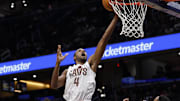 Dec 12, 2025; Washington, District of Columbia, USA; Cleveland Cavaliers center Evan Mobley (4) shoots the ball over Washington Wizards guard CJ McCollum (3) and Wizards forward Marvin Bagley III (35) in the second half at Capital One Arena. Mandatory Credit: Geoff Burke-Imagn Images