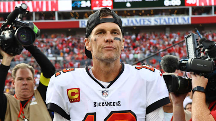 Jan 1, 2023; Tampa, Florida, USA; Tampa Bay Buccaneers quarterback Tom Brady (12) runs off the field after they beat the Carolina Panthers t Raymond James Stadium. Mandatory Credit: Kim Klement-Imagn Images