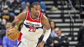 Mar 19, 2025; Salt Lake City, Utah, USA;  Washington Wizards center Alex Sarr (20) make a breakaway against the Utah Jazz during the first half at the Delta Center. Mandatory Credit: Peter Creveling-Imagn Images