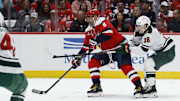 Oct 17, 2025; Washington, District of Columbia, USA; Washington Capitals left wing Alex Ovechkin (8) prepares to shoot the puck s Minnesota Wild left wing Liam Ohgren (28) defends during the first period at Capital One Arena. Mandatory Credit: Geoff Burke-Imagn Images