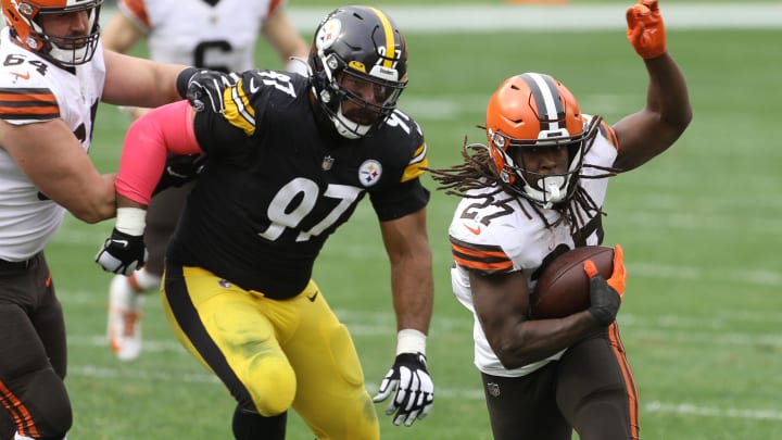 Oct 18, 2020; Pittsburgh, Pennsylvania, USA;  Cleveland Browns running back Kareem Hunt (27) runs after a catch against Pittsburgh Steelers defensive end Cameron Heyward (97) chases during the second quarter at Heinz Field. Mandatory Credit: Charles LeClaire-USA TODAY Sports