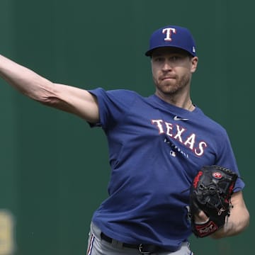 May 23, 2023; Pittsburgh, Pennsylvania, USA; Texas Rangers pitcher Jacob deGrom (48) throws in the outfield before the game against the Pittsburgh Pirates at PNC Park. 