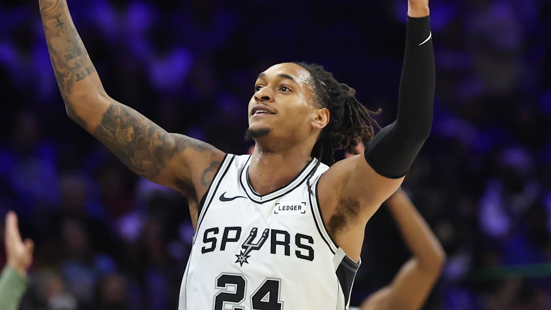 Mar 3, 2026; Philadelphia, Pennsylvania, USA; San Antonio Spurs guard Devin Vassell (24) reacts to his three pointer against the Philadelphia 76ers during the third quarter at Xfinity Mobile Arena. Mandatory Credit: Bill Streicher-Imagn Images