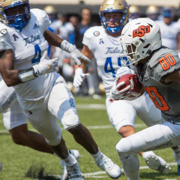 Sep 11, 2021; Stillwater, Oklahoma, USA;  Oklahoma State Cowboys wide receiver Brennan Presley (80) runs with the ball during the fourth quarter against the Tulsa Golden Hurricane at Boone Pickens Stadium. The Cowboys won 28-23. Mandatory Credit: Brett Rojo-USA TODAY Sports