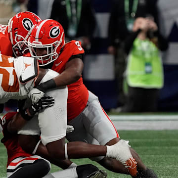 Georgia linebacker CJ Allen (3) takes down Texas running back Quintrevion Wisner (26) during the first half of the SEC championship game against Texas in Atlanta, on Saturday, Dec. 7, 2024.