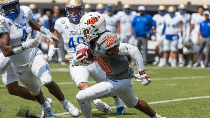 Sep 11, 2021; Stillwater, Oklahoma, USA;  Oklahoma State Cowboys wide receiver Brennan Presley (80) runs with the ball during the fourth quarter against the Tulsa Golden Hurricane at Boone Pickens Stadium. The Cowboys won 28-23. Mandatory Credit: Brett Rojo-USA TODAY Sports