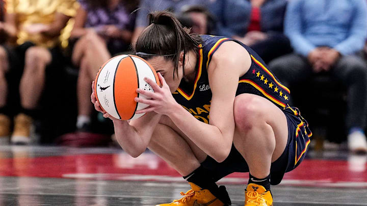 Indiana Fever guard Caitlin Clark (22) kneels down in frustration after a turnover call from the referee on Wednesday, Sept. 4, 2024, during the game at Gainbridge Fieldhouse in Indianapolis.