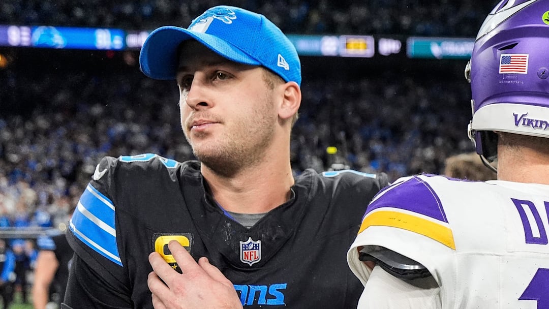 Detroit Lions quarterback Jared Goff (16) hugs Minnesota Vikings quarterback Sam Darnold (14) after 31-9 win at Ford Field in Detroit on Sunday, Jan. 5, 2025.