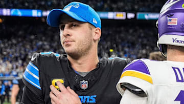 Detroit Lions quarterback Jared Goff (16) hugs Minnesota Vikings quarterback Sam Darnold (14) after 31-9 win at Ford Field in Detroit on Sunday, Jan. 5, 2025.