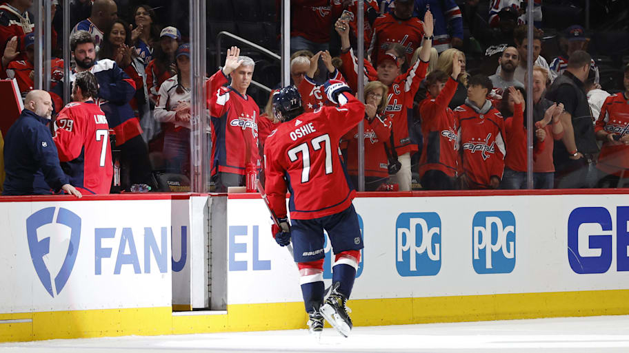Washington Capitals right wing T.J. Oshie  waves to the fans while leaving the ice | Geoff Burke-Imagn Images