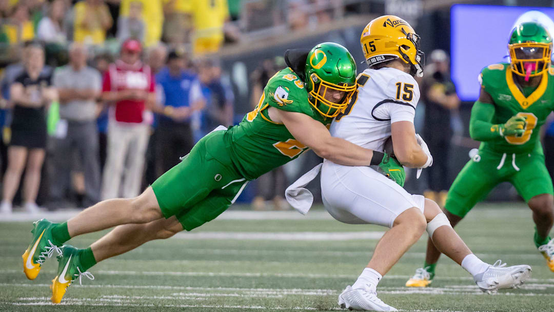 Oregon Ducks linebacker Bryce Boettcher brings down Idaho Vandals wide receiver Mark Hamper as the Oregon Ducks host the Idaho Vandals Saturday, Aug. 31, 2024 at Autzen Stadium in Eugene, Ore.