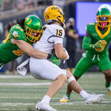 Oregon Ducks linebacker Bryce Boettcher brings down Idaho Vandals wide receiver Mark Hamper as the Oregon Ducks host the Idaho Vandals Saturday, Aug. 31, 2024 at Autzen Stadium in Eugene, Ore.