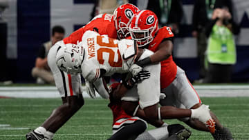 Georgia linebacker CJ Allen (3) takes down Texas running back Quintrevion Wisner (26) during the first half of the SEC championship game against Texas in Atlanta, on Saturday, Dec. 7, 2024.