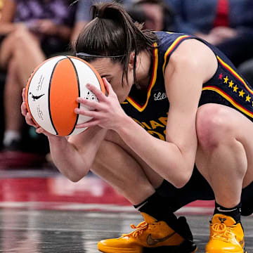 Indiana Fever guard Caitlin Clark (22) kneels down in frustration after a turnover call from the referee on Wednesday, Sept. 4, 2024, during the game at Gainbridge Fieldhouse in Indianapolis.