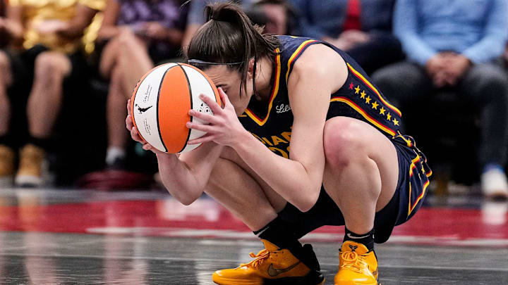 Indiana Fever guard Caitlin Clark (22) kneels down in frustration after a turnover call from the referee on Wednesday, Sept. 4, 2024, during the game at Gainbridge Fieldhouse in Indianapolis.