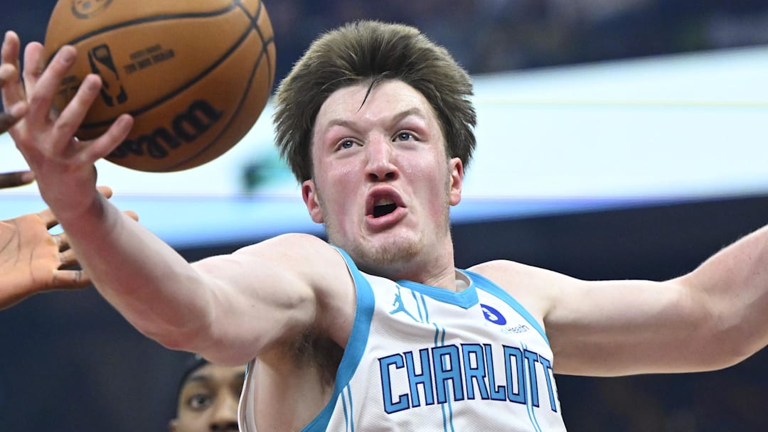Dec 14, 2025; Cleveland, Ohio, USA; Charlotte Hornets guard Kon Knueppel (7) rebounds in the first quarter against the Cleveland Cavaliers at Rocket Arena. Mandatory Credit: David Richard-Imagn Images