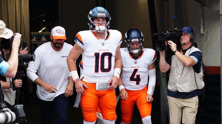 Denver Broncos quarterback Bo Nix (10) and quarterback Zach Wilson (4) before the preseason game against the Green Bay Packers at Empower Field at Mile High. 