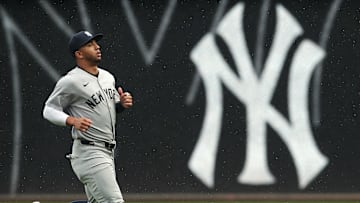Apr 5, 2025; Pittsburgh, Pennsylvania, USA;  New York Yankees third baseman Oswald Peraza (18) warms up in the outfield against the Pittsburgh Pirates at PNC Park. Mandatory Credit: Charles LeClaire-Imagn Images